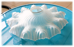 A white object on a blue surface

Description automatically generated
