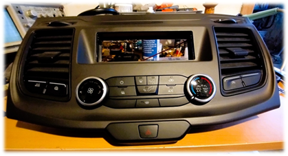 A car stereo on a table

Description automatically generated