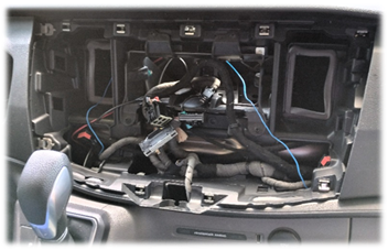 The inside of a car with wires and wires

Description automatically generated